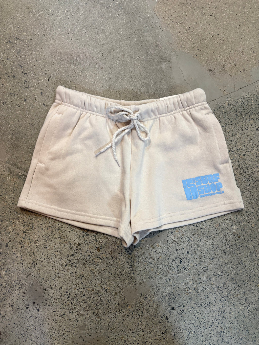 15th St Women's Groovy Drip Side Pocket Fleece Shorts BABY BLUE on SAND